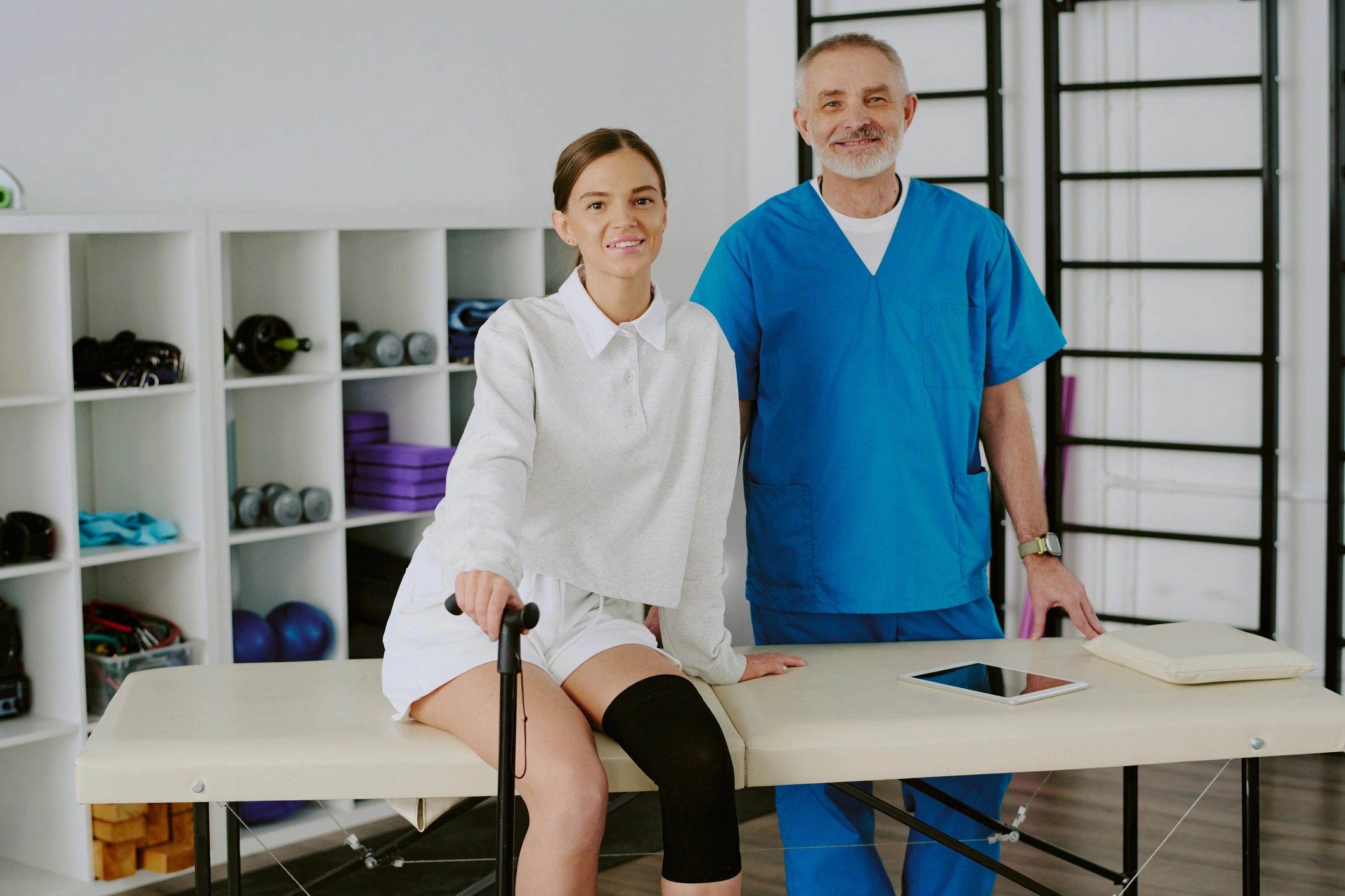Doctor speaking with patient in a clinical environment